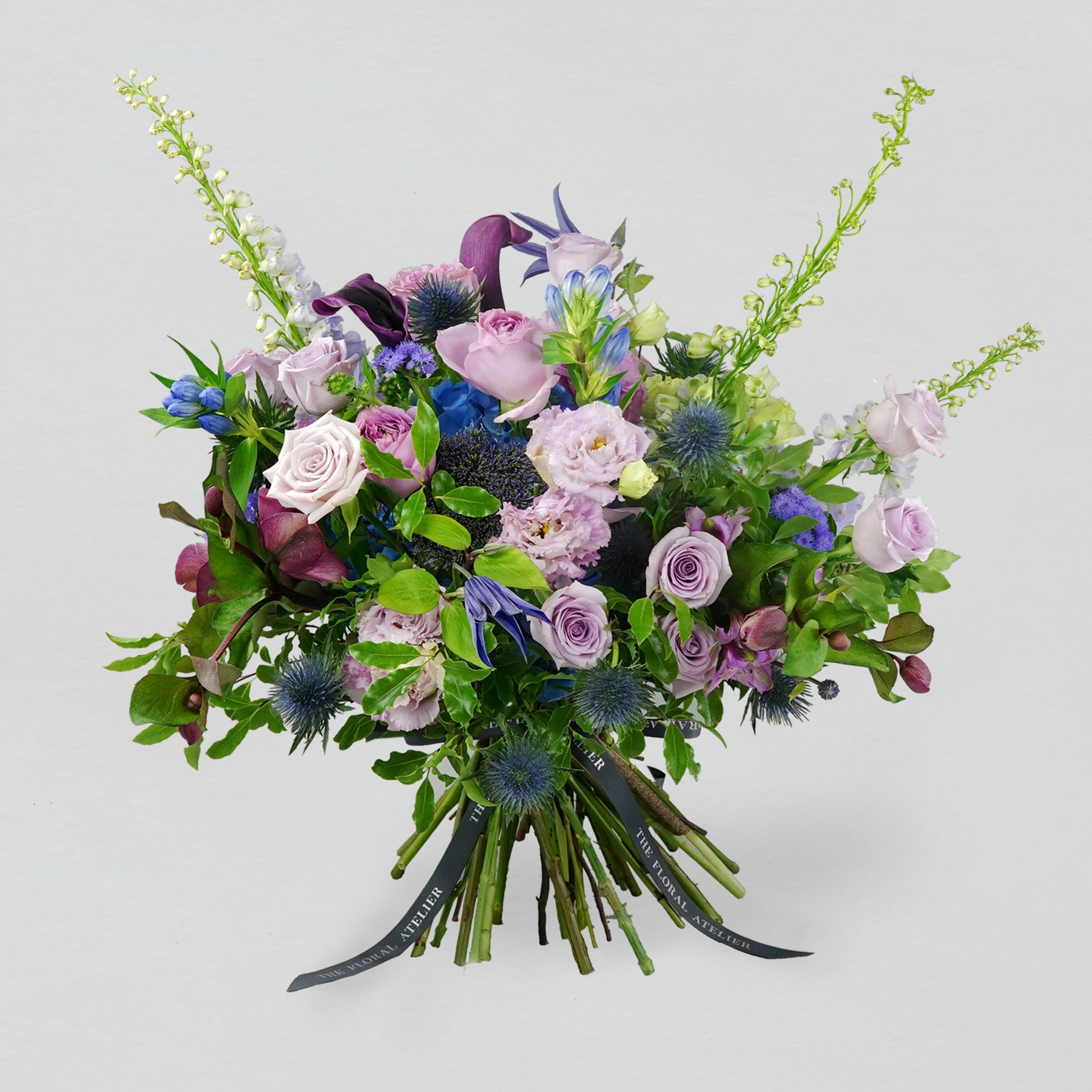 Fresh violet, lilac and blue florals arranged in a bouquet