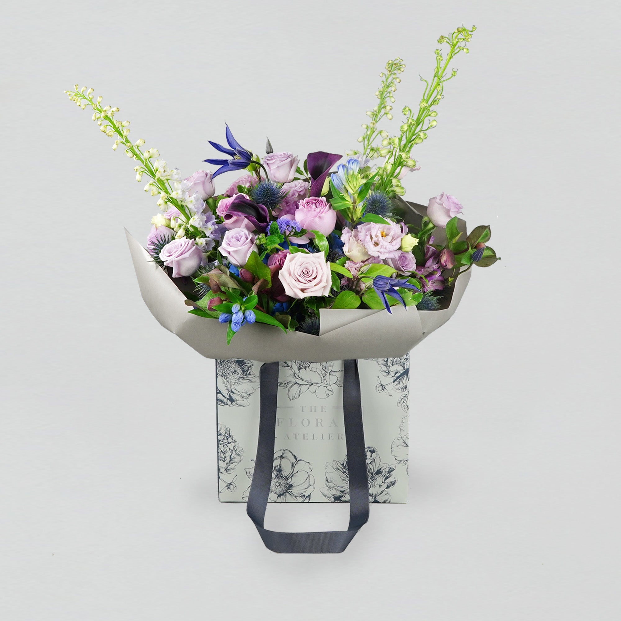 Fresh violet, lilac and blue florals arranged in a bouquet
