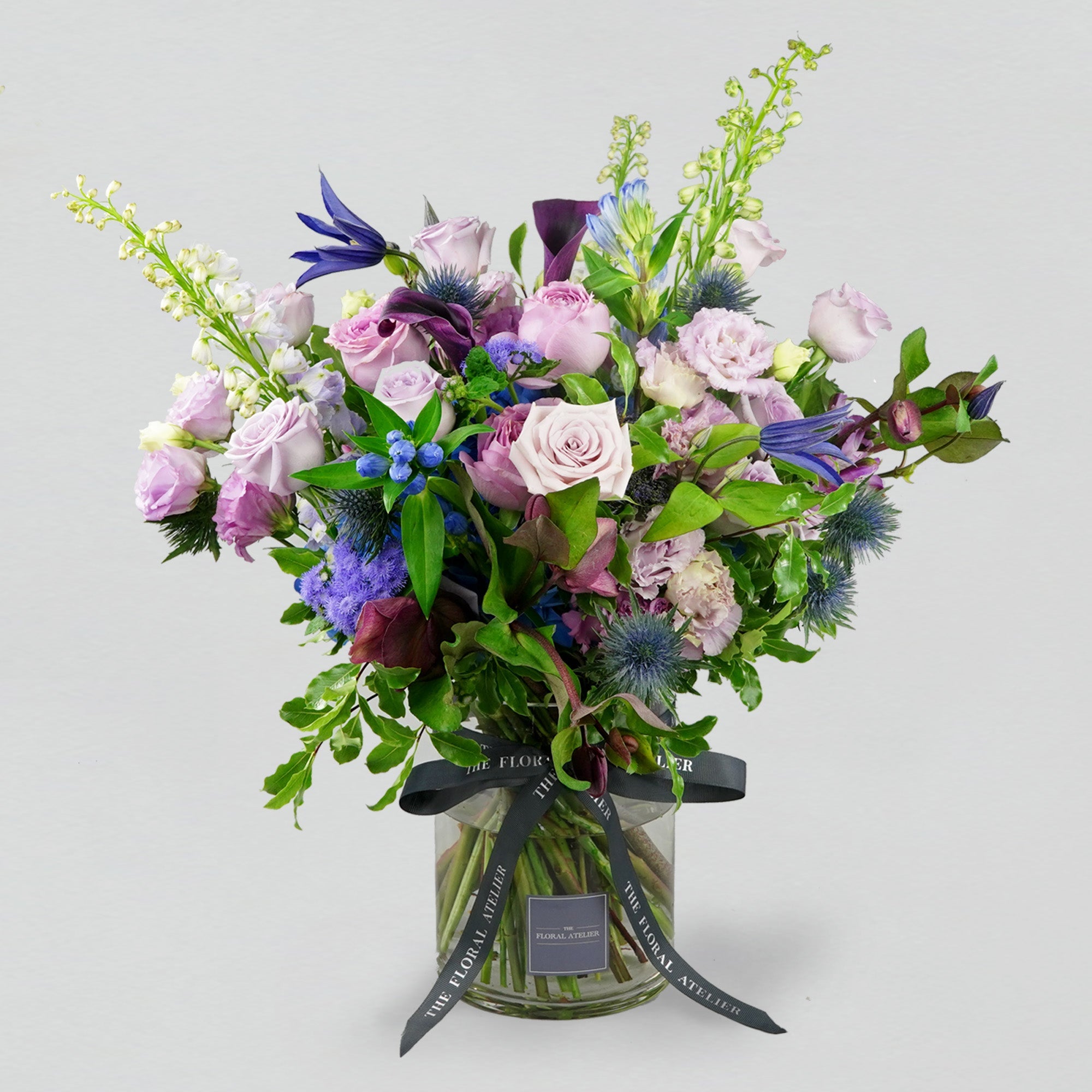 Fresh violet, lilac and blue florals arranged in a bouquet