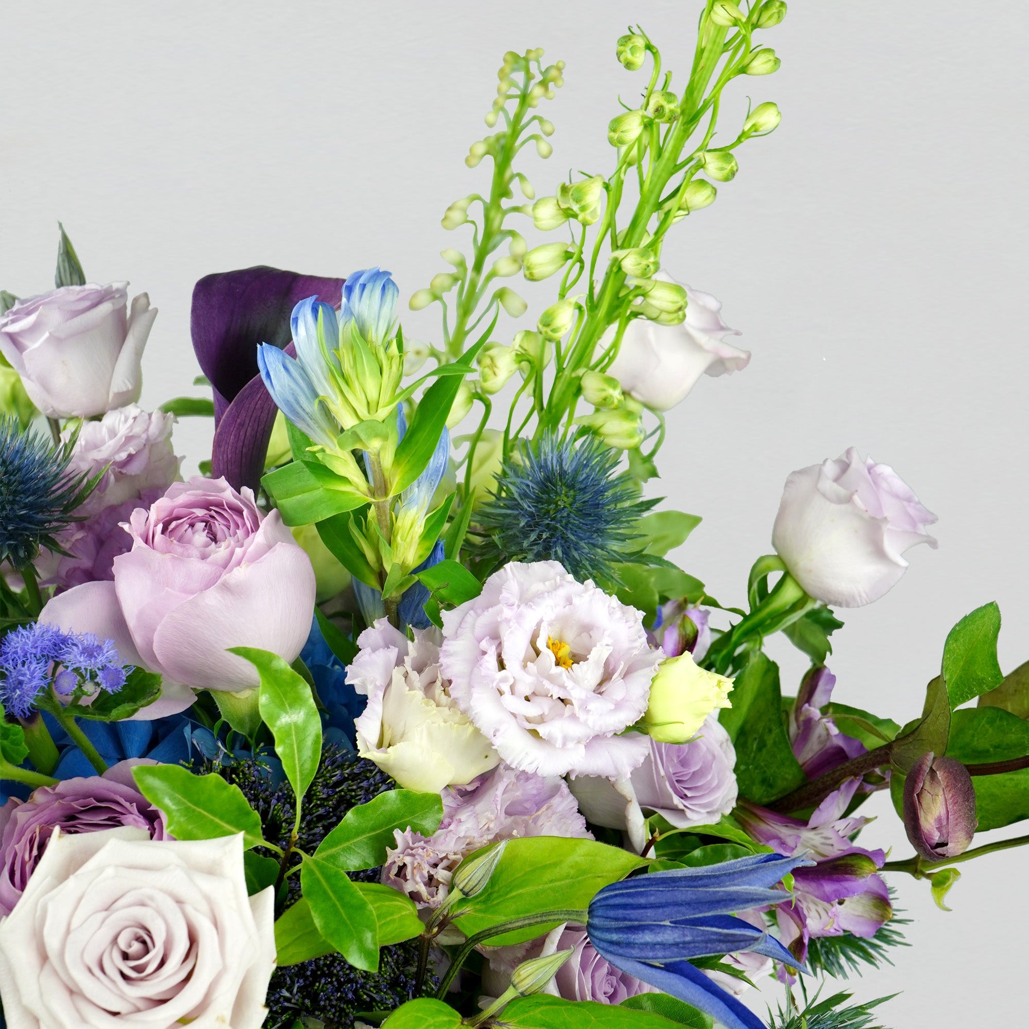 Fresh violet, lilac and blue florals arranged in a bouquet