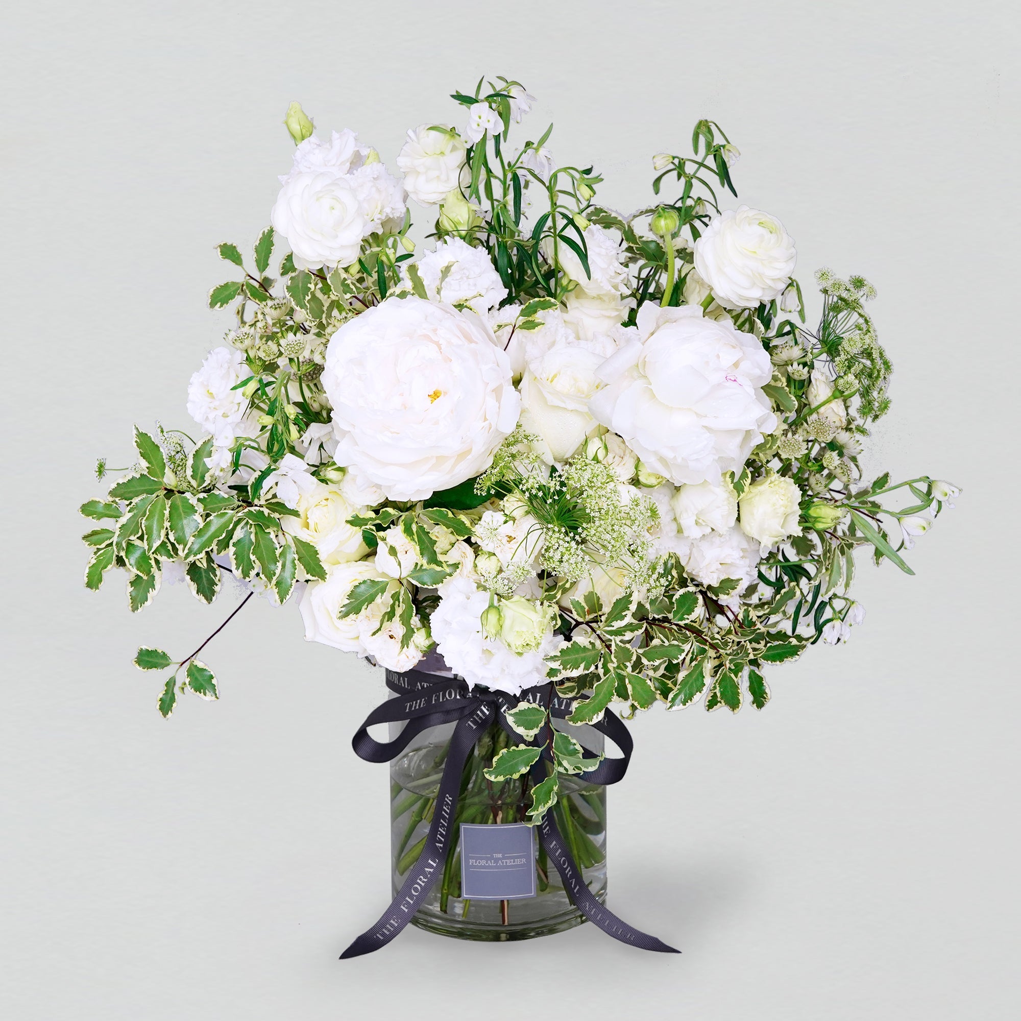 Fresh white and green florals arranged in a bouquet