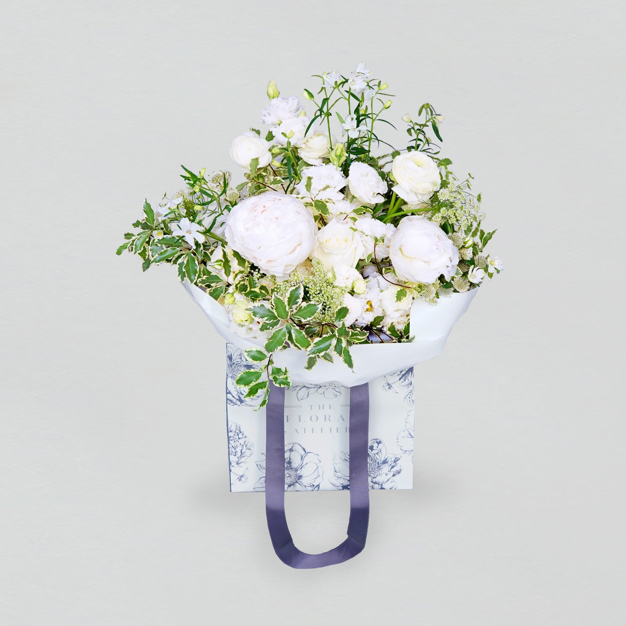 Fresh white and green florals arranged in a bouquet