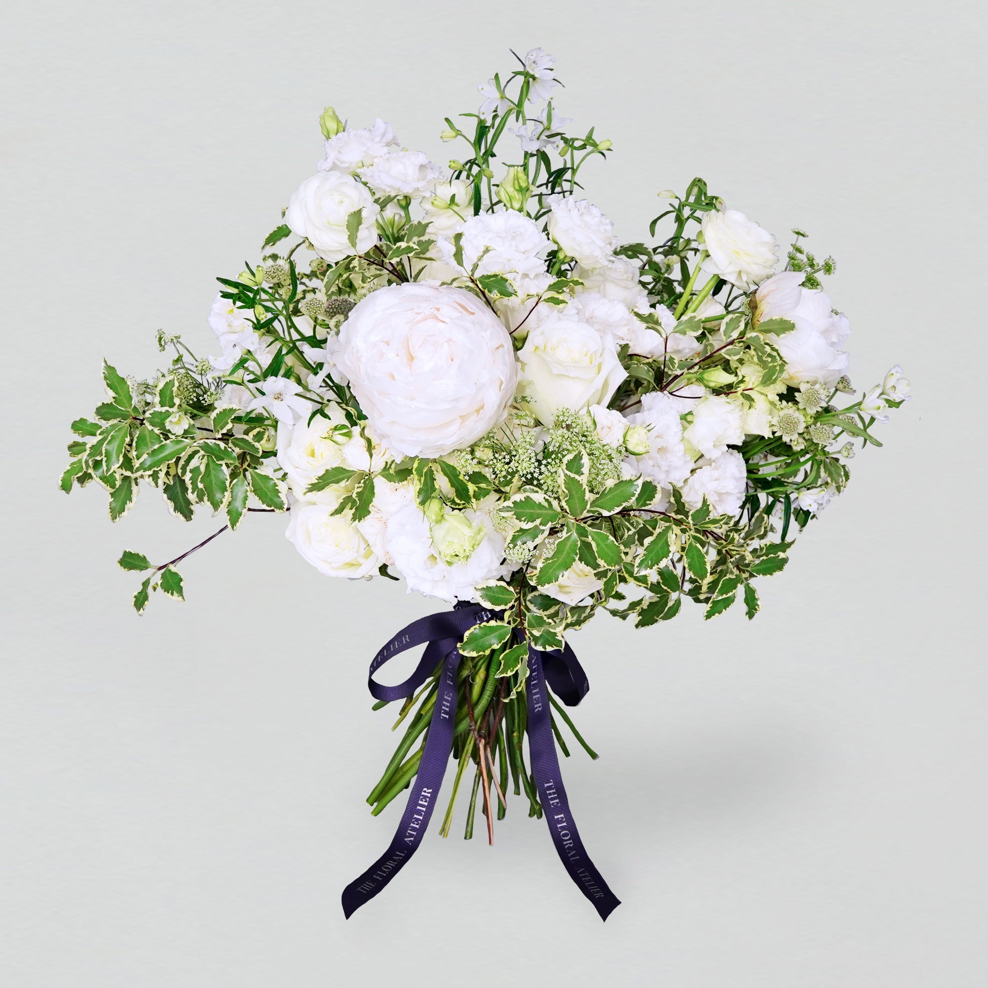 Fresh white and green florals arranged in a bouquet